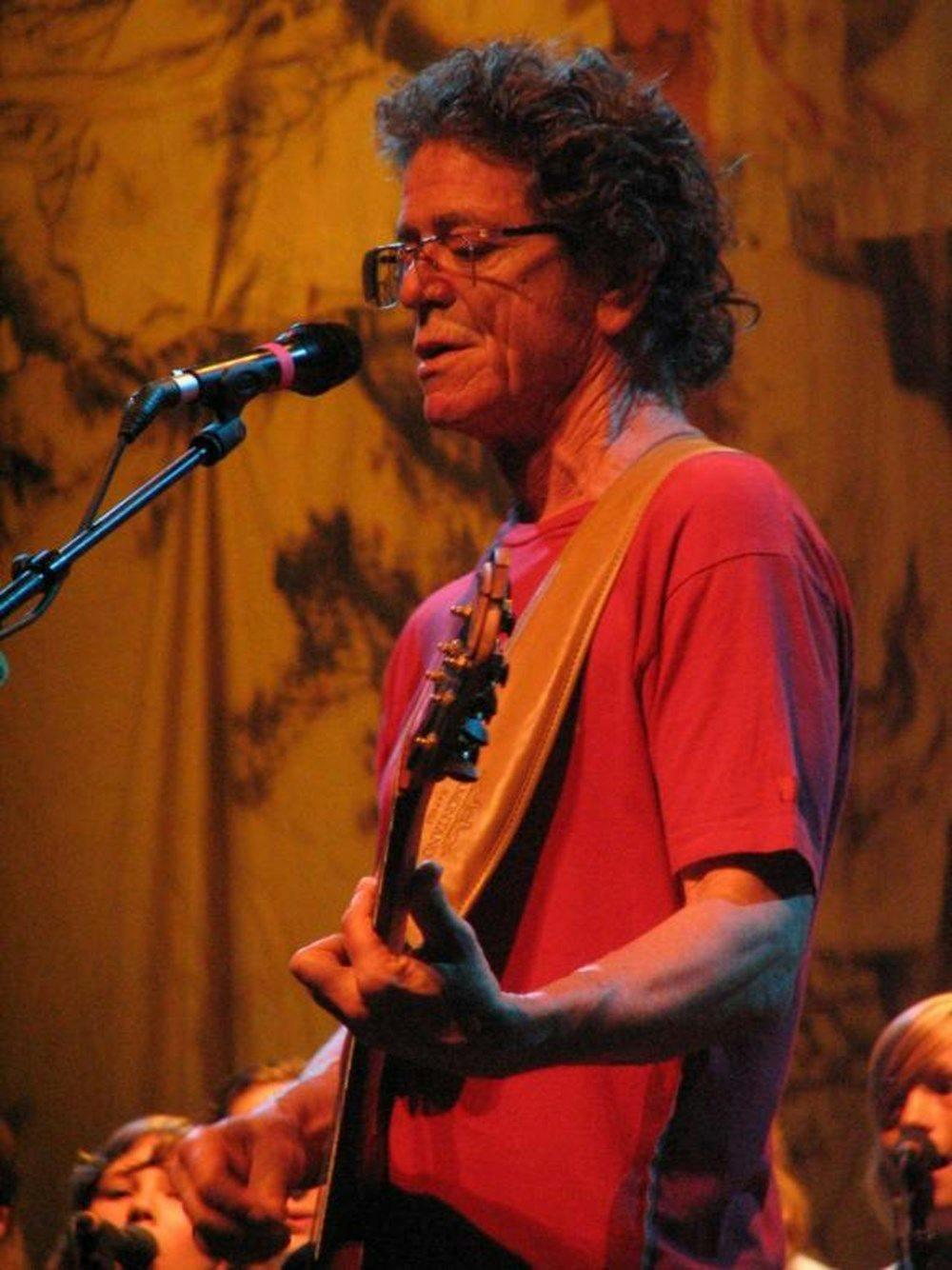 Lou Reed plays guitar and sings.