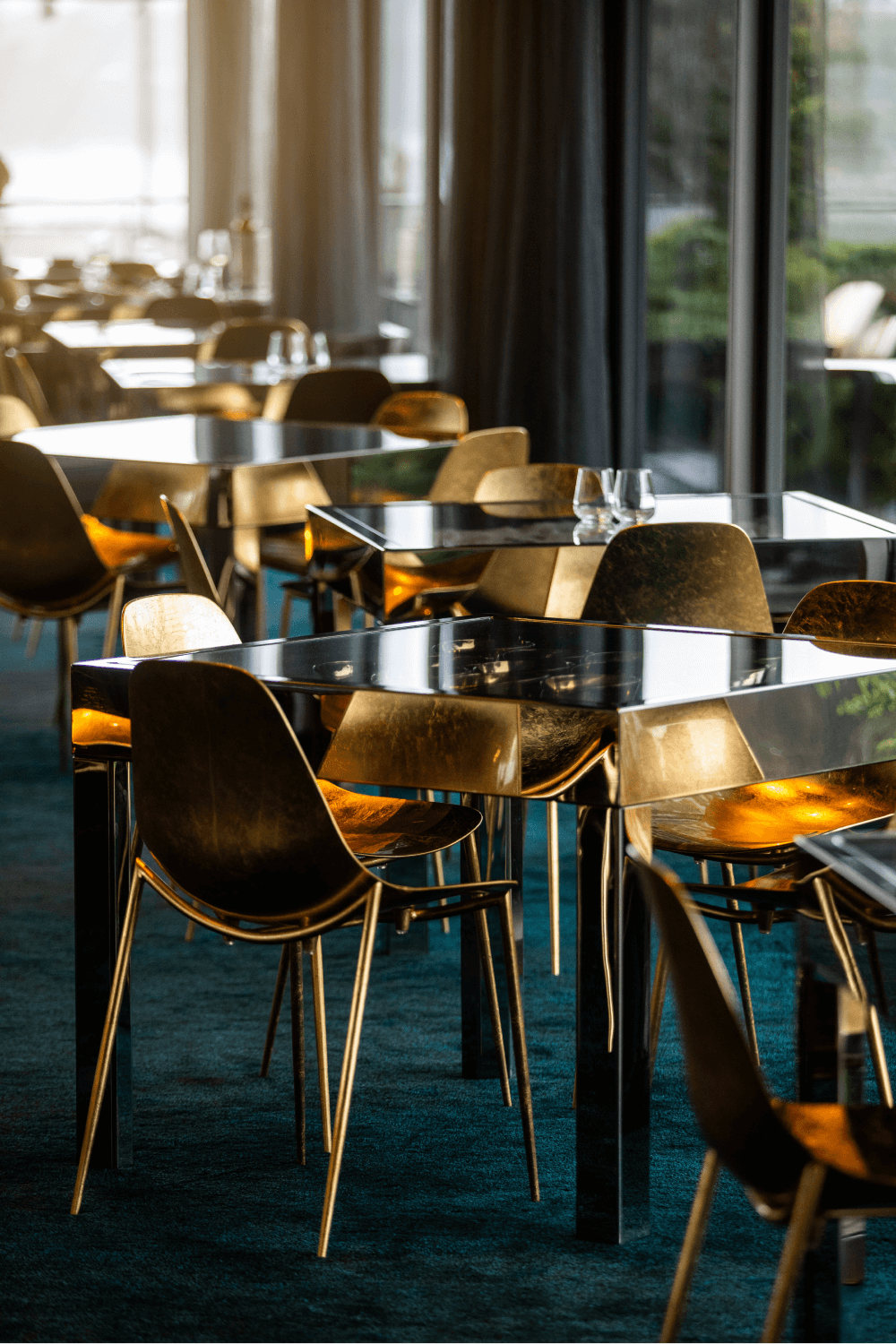 Plush carpet, glass tables and gold seats of the Source