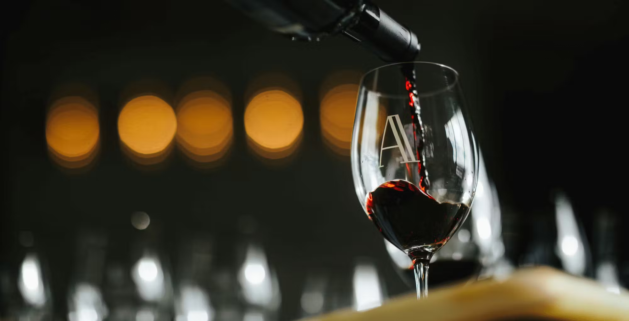 Red wine being poured into a Domaine A wine glass