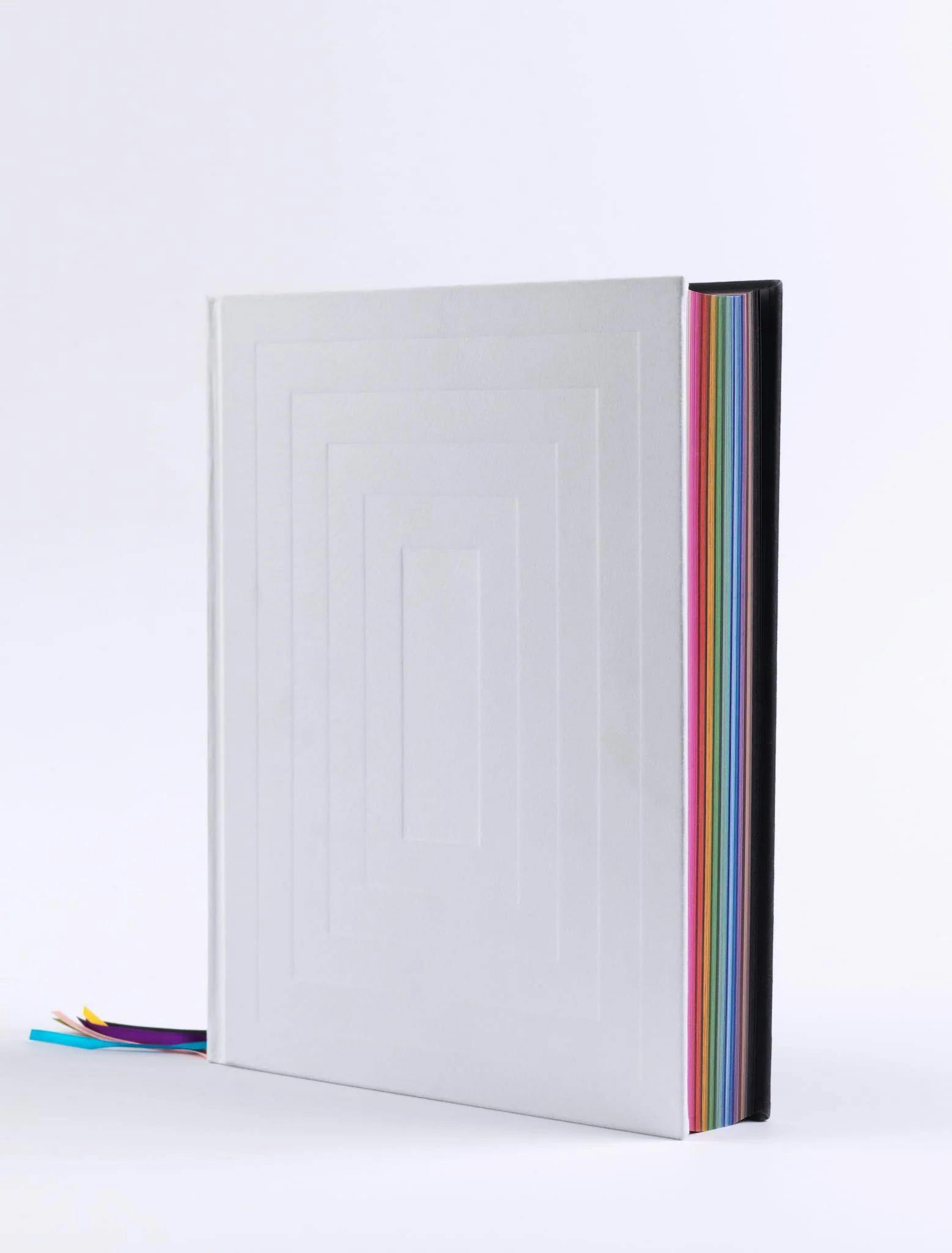 Eat The Problem exhibition catalogue, with a white hardback